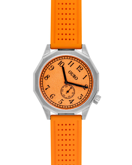 Driver’s watch OURO RW-003 boîtier dodécagonal (à 12 cotés) en acier avec cadran inox orange grainé à 45° et bracelet en silicone bleu marine perforé.